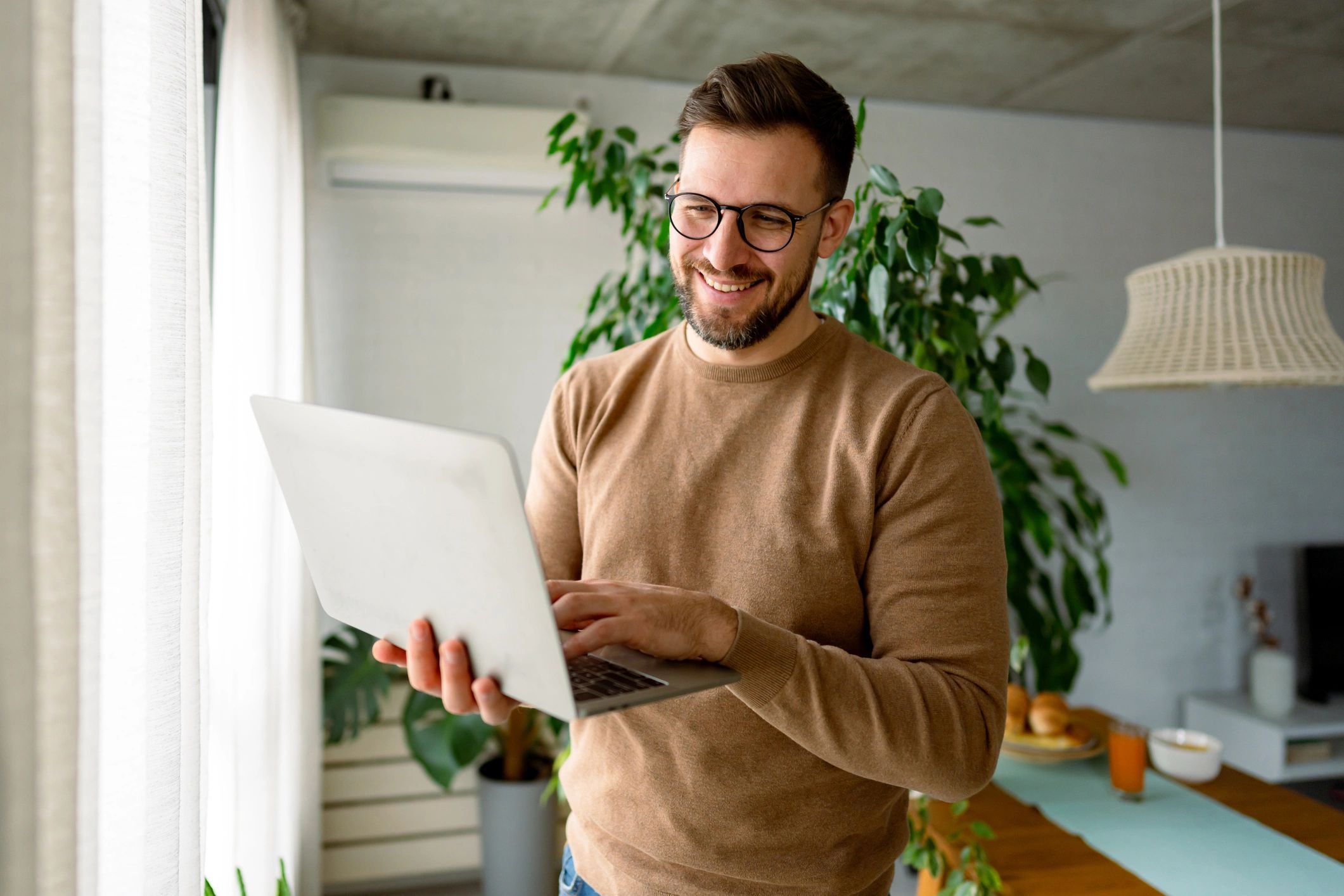 Smiling customer using a laptop